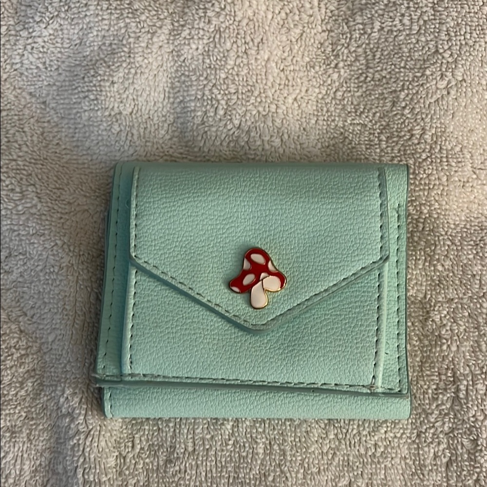 Claire’s Mint Green Wallet with Mushroom Accent